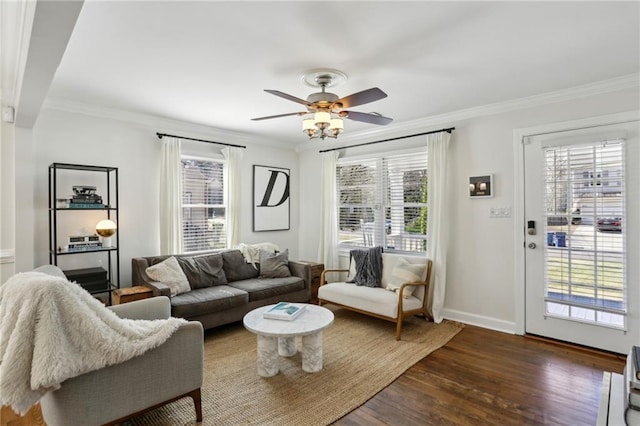 living room with dark wood-type flooring and ornamental molding