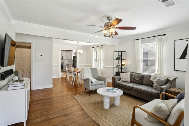 living room with crown molding, dark wood-style floors, visible vents, and baseboards