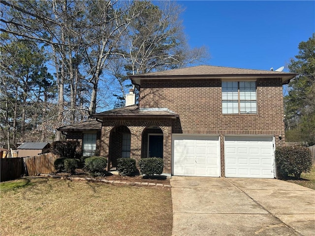 traditional-style house featuring a front yard, fence, an attached garage, concrete driveway, and brick siding