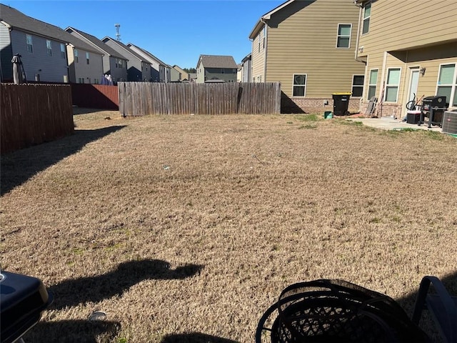 view of yard featuring a residential view and fence