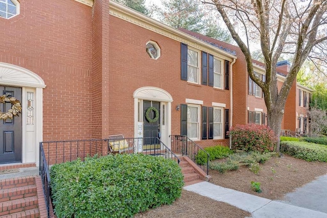 view of property with brick siding