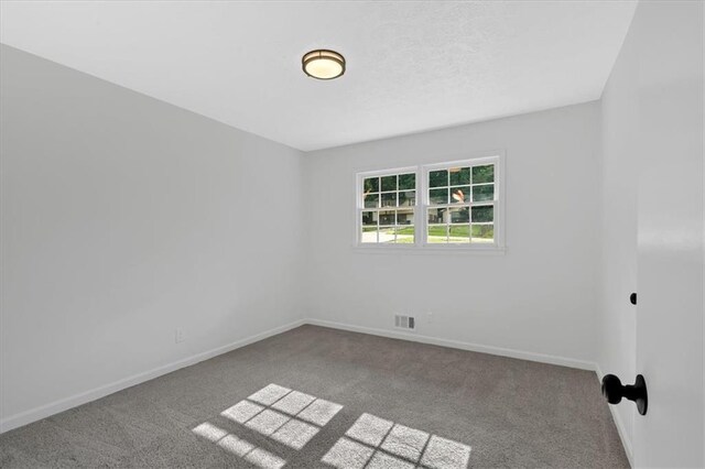 5689 Woodland Dr, Acworth, GA 30102 - carpeted empty room with baseboards