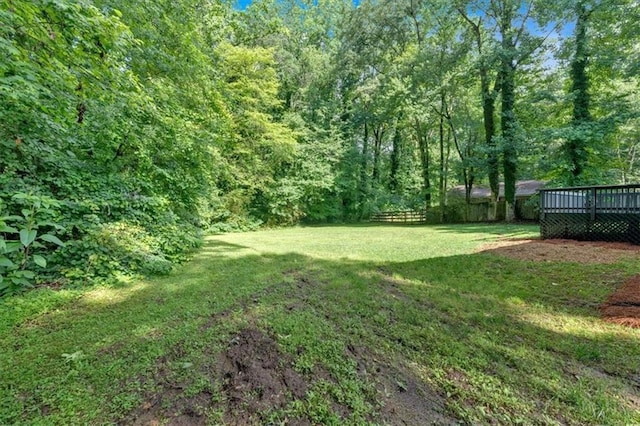 5689 Woodland Dr, Acworth, GA 30102 - view of yard featuring a wooden deck and a forest view