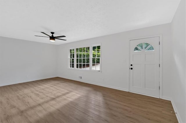 5689 Woodland Dr, Acworth, GA 30102 - entrance foyer with plenty of natural light, wood finished floors, and ceiling fan