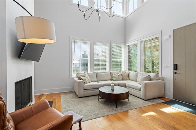 155 Breakspear Ln, Fayetteville, GA 30214 - living room featuring plenty of natural light, wood finished floors, a fireplace, and a high ceiling