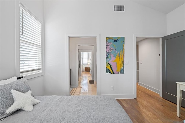 155 Breakspear Ln, Fayetteville, GA 30214 - bedroom featuring high vaulted ceiling, wood finished floors, and baseboards