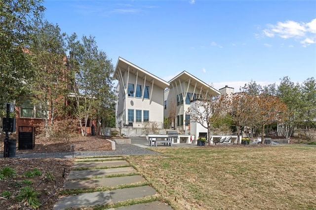 155 Breakspear Ln, Fayetteville, GA 30214 - rear view of property featuring a lawn and a patio area