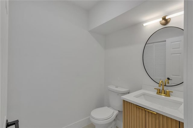 2601 Garland Way, Duluth, GA 30096 - half bath featuring toilet, vanity, and baseboards