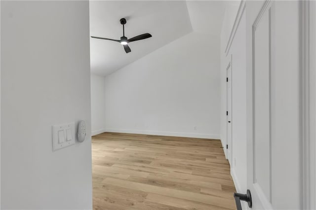 2601 Garland Way, Duluth, GA 30096 - spare room featuring vaulted ceiling, ceiling fan, light wood-style flooring, and baseboards