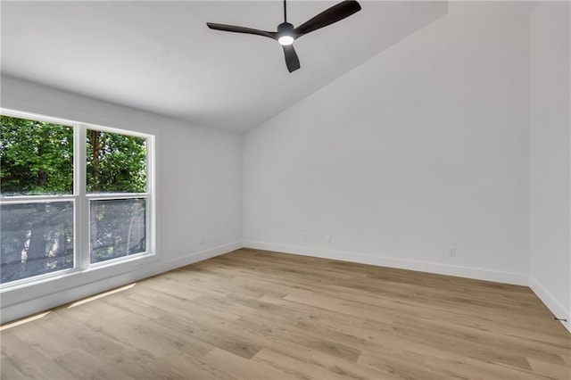 2601 Garland Way, Duluth, GA 30096 - unfurnished room with lofted ceiling, light wood-style floors, a ceiling fan, and baseboards
