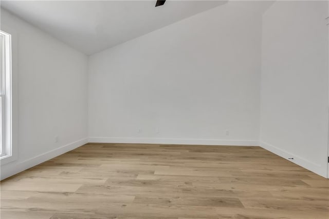 2601 Garland Way, Duluth, GA 30096 - unfurnished room with light wood-type flooring, baseboards, and lofted ceiling