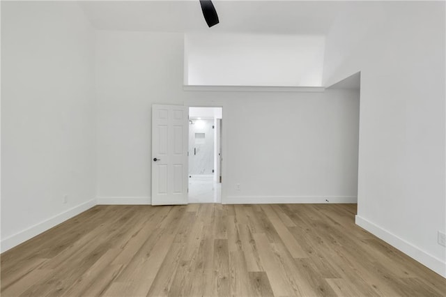 2601 Garland Way, Duluth, GA 30096 - unfurnished room with light wood finished floors, baseboards, and a towering ceiling