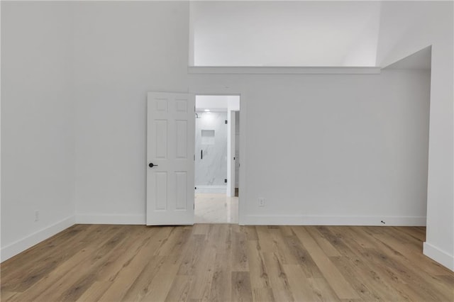 2601 Garland Way, Duluth, GA 30096 - spare room with light wood-style floors and baseboards