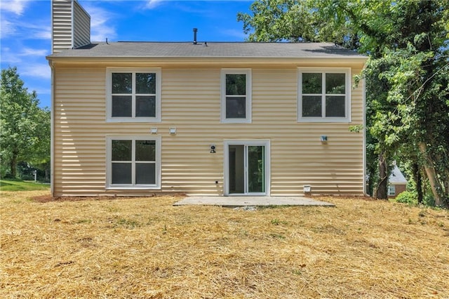 2601 Garland Way, Duluth, GA 30096 - rear view of house with a chimney, a yard, and roof with shingles