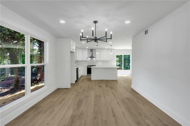 2601 Garland Way, Duluth, GA 30096 - unfurnished living room with a chandelier, light wood-type flooring, baseboards, and recessed lighting