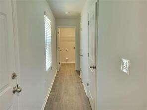 115 Deer Xing, Temple, GA 30179 - hall with baseboards and wood finished floors