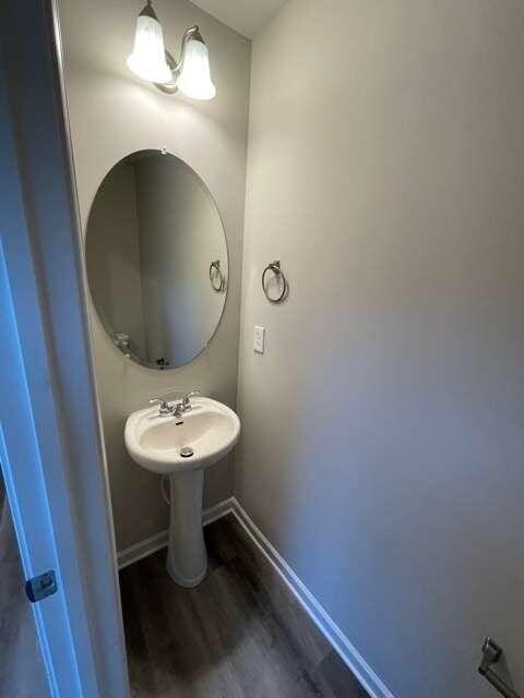 115 Deer Xing, Temple, GA 30179 - bathroom featuring wood finished floors, baseboards, and a sink