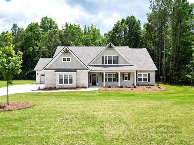 2109 Ella Springs Dr, Covington, GA 30014 - craftsman house with driveway, board and batten siding, a front yard, and a garage