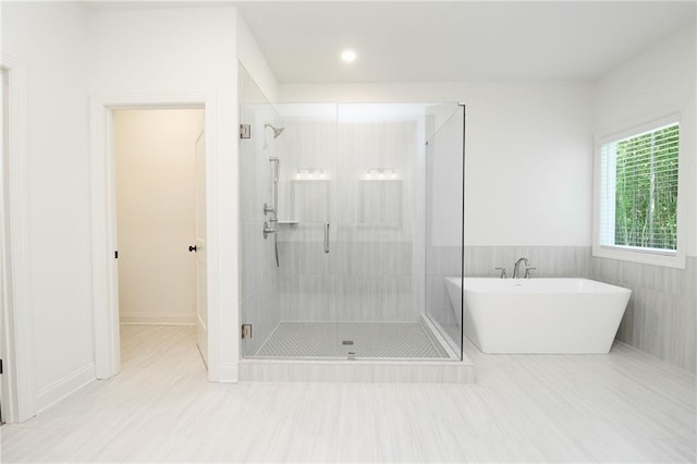 2109 Ella Springs Dr, Covington, GA 30014 - full bathroom featuring a stall shower, a freestanding tub, and recessed lighting