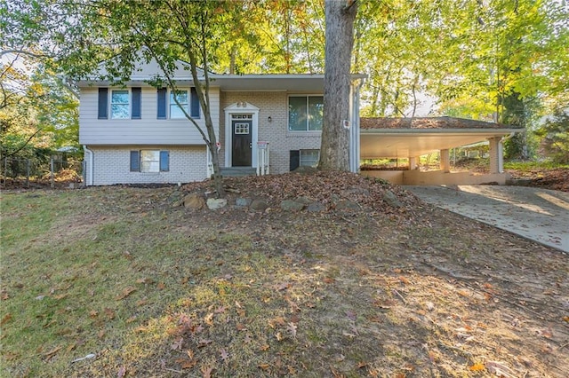 raised ranch featuring a carport