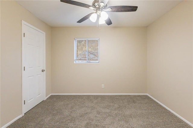 empty room featuring carpet floors and ceiling fan