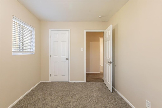 unfurnished bedroom featuring carpet flooring