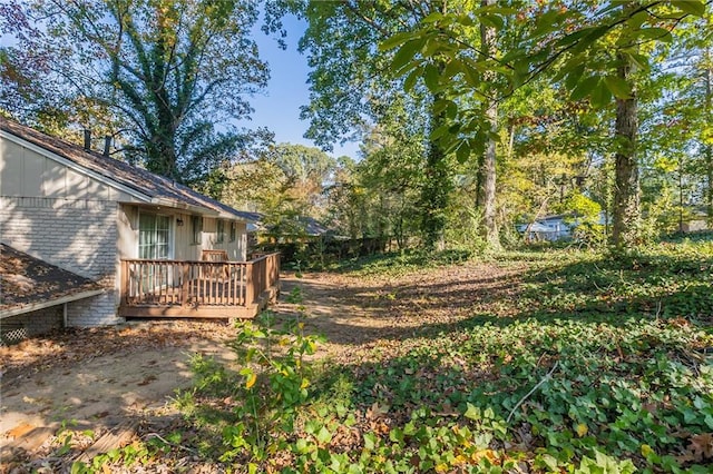 view of yard with a wooden deck