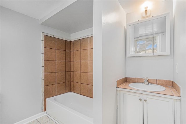 bathroom with vanity, tile patterned floors, and tiled shower / bath