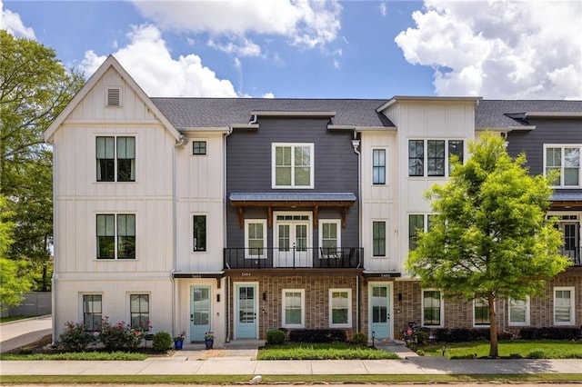 3484 Orchard St, Atlanta, GA 30354 - townhome / multi-family property featuring board and batten siding, a balcony, and french doors