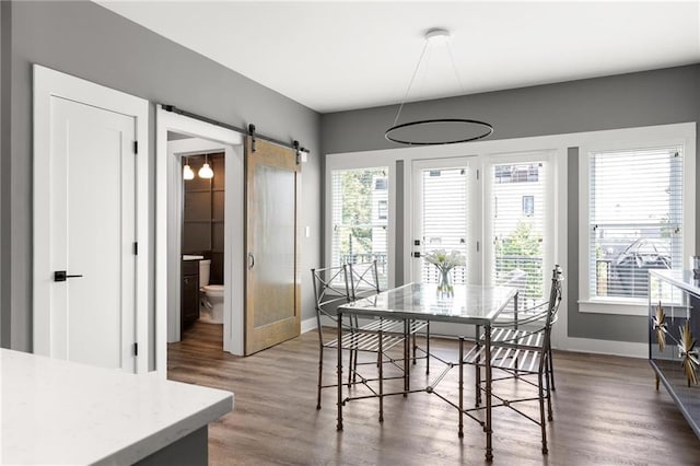 3484 Orchard St, Atlanta, GA 30354 - dining space with a barn door and wood finished floors