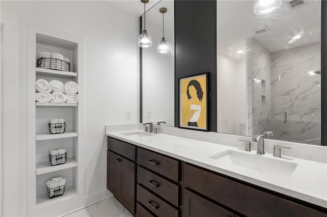3484 Orchard St, Atlanta, GA 30354 - full bathroom with double vanity, a marble finish shower, built in shelves, and marble look tiles