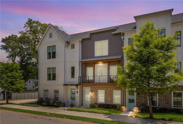 3484 Orchard St, Atlanta, GA 30354 - townhome / multi-family property with a balcony, board and batten siding, brick siding, and a shingled roof