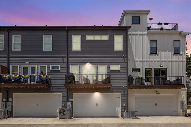 3484 Orchard St, Atlanta, GA 30354 - back of property at dusk with a garage and board and batten siding