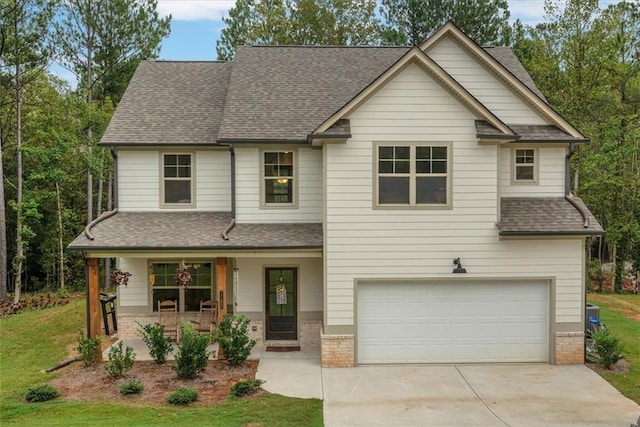 view of front of home featuring a garage and a porch