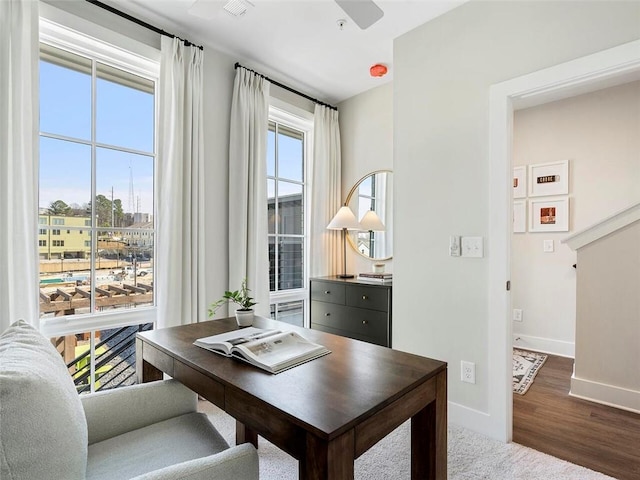 office space featuring wood finished floors and baseboards