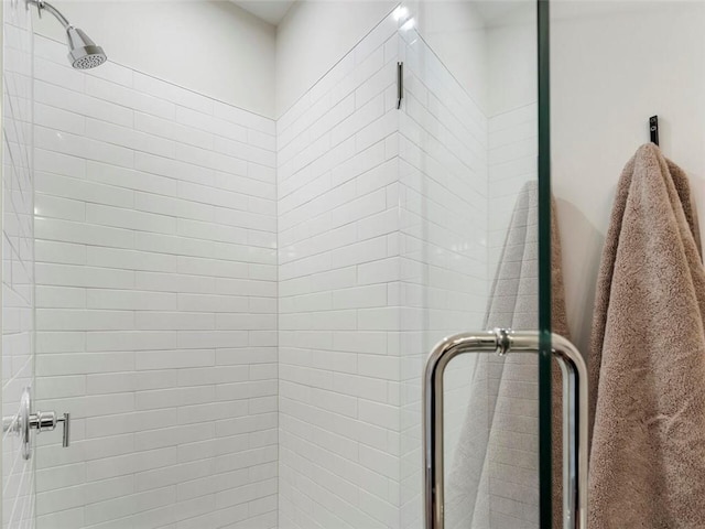 bathroom with a shower stall