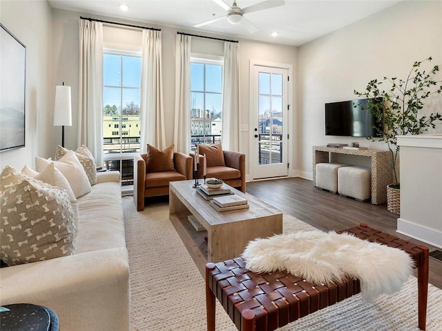 living room with ceiling fan, recessed lighting, wood finished floors, and baseboards