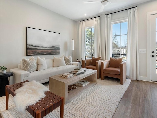 living room with light wood-style flooring, ceiling fan, and recessed lighting