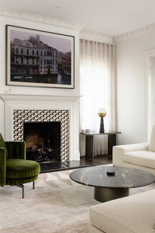 living room with a tile fireplace