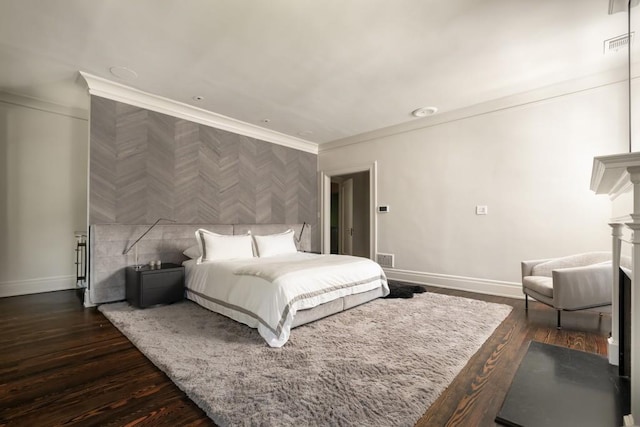 bedroom with tile walls, dark hardwood / wood-style floors, and crown molding