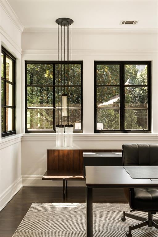 office space with ornamental molding, a wealth of natural light, a chandelier, and hardwood / wood-style flooring