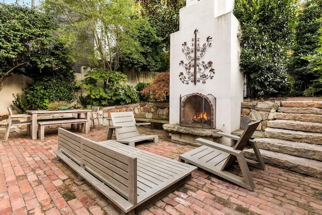 view of patio / terrace with exterior fireplace