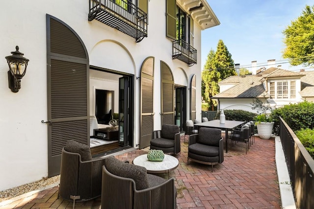 view of patio / terrace with a balcony