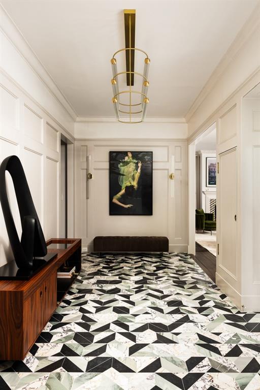 mudroom featuring crown molding