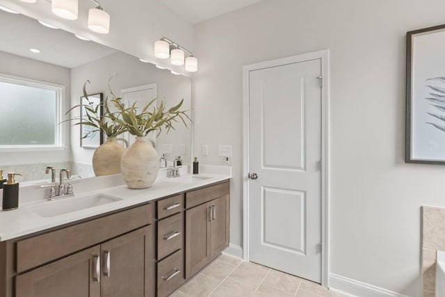 bathroom with tile patterned flooring and vanity