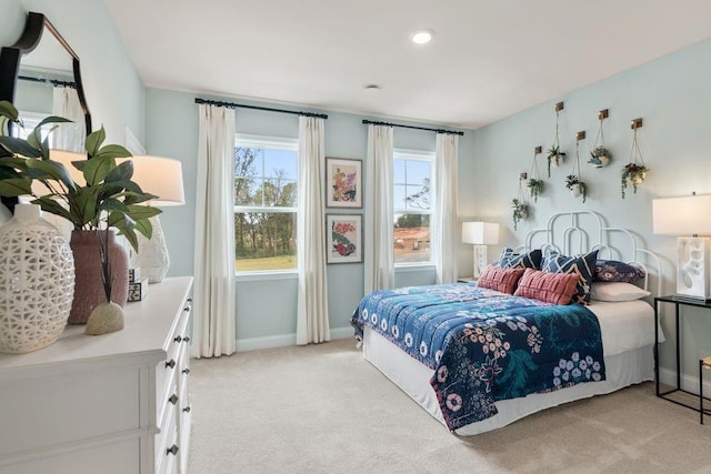 bedroom featuring light colored carpet