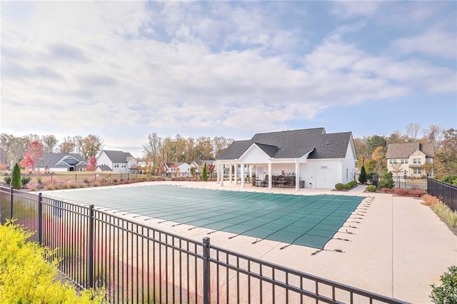 view of swimming pool with a patio area