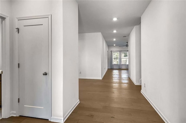 hall with french doors and dark hardwood / wood-style flooring