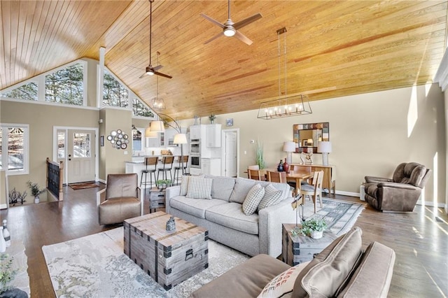 living room with wood ceiling, high vaulted ceiling, wood finished floors, and a wealth of natural light