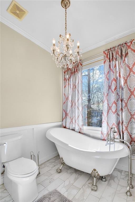 full bathroom featuring toilet, marble finish floor, visible vents, and crown molding